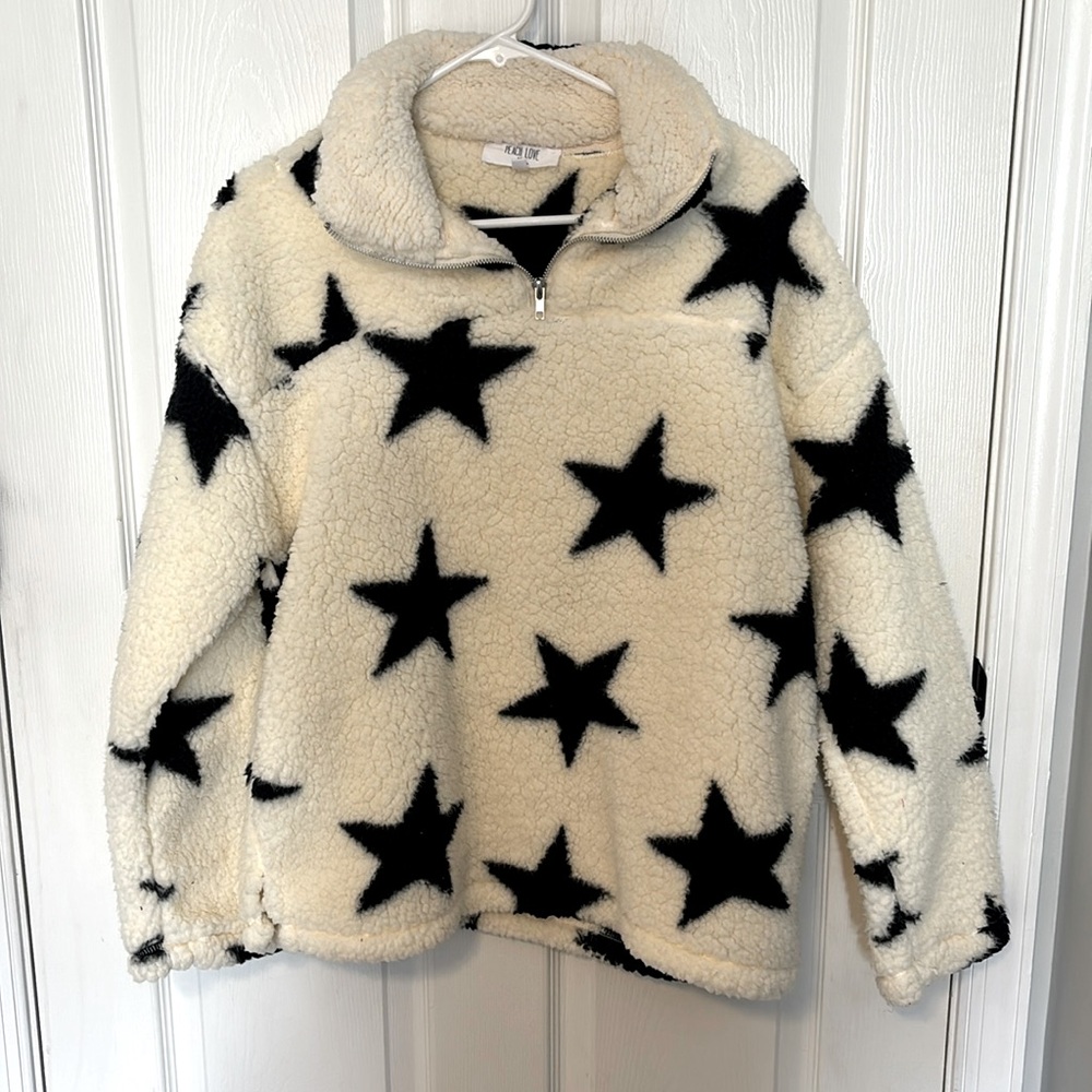 Women’s fuzzy shrug sweater cream with black stars